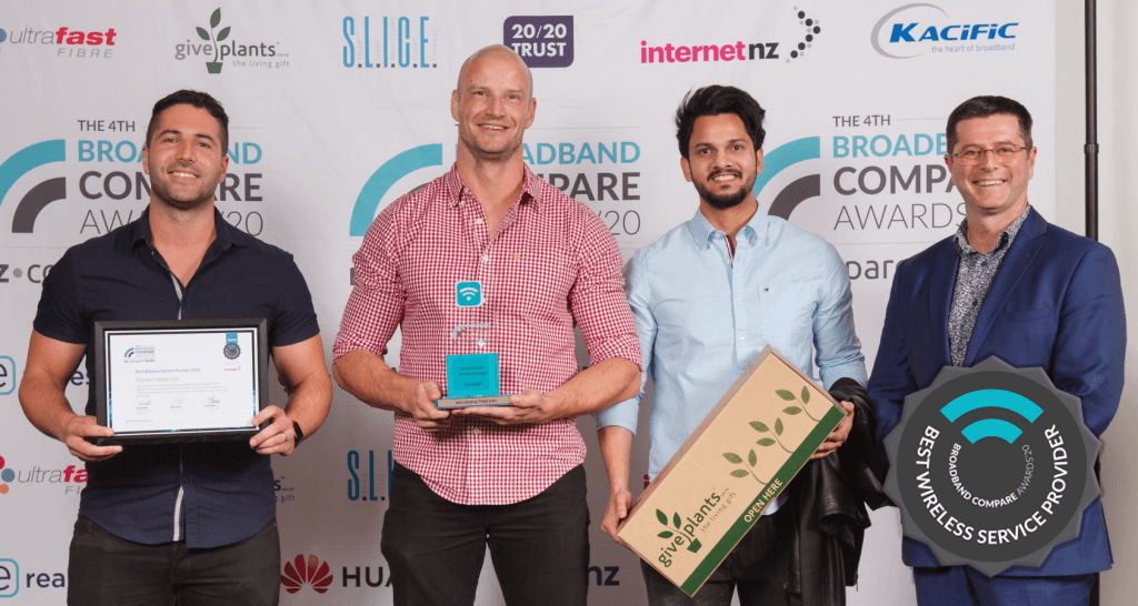 Wireless Nation team members on stage accepting the award